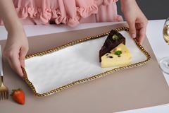 TRAVESSA PORCELANA BORDA TITÂNIO DOURADA 35X16CM GOLDEN SALERNO   